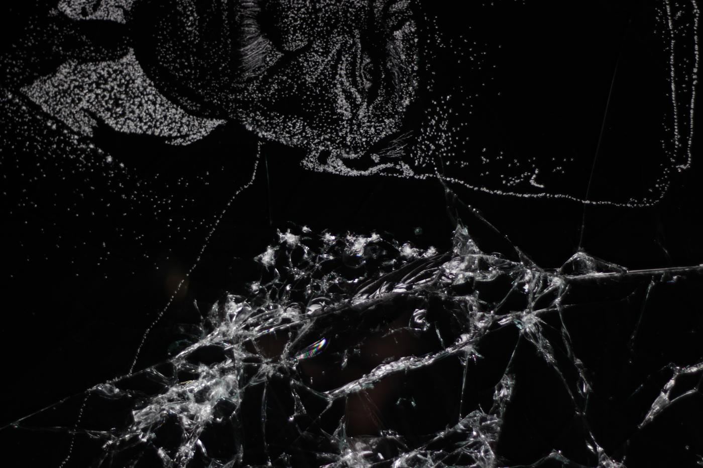 Detail of an earlier Atatürk portrait in broken glass