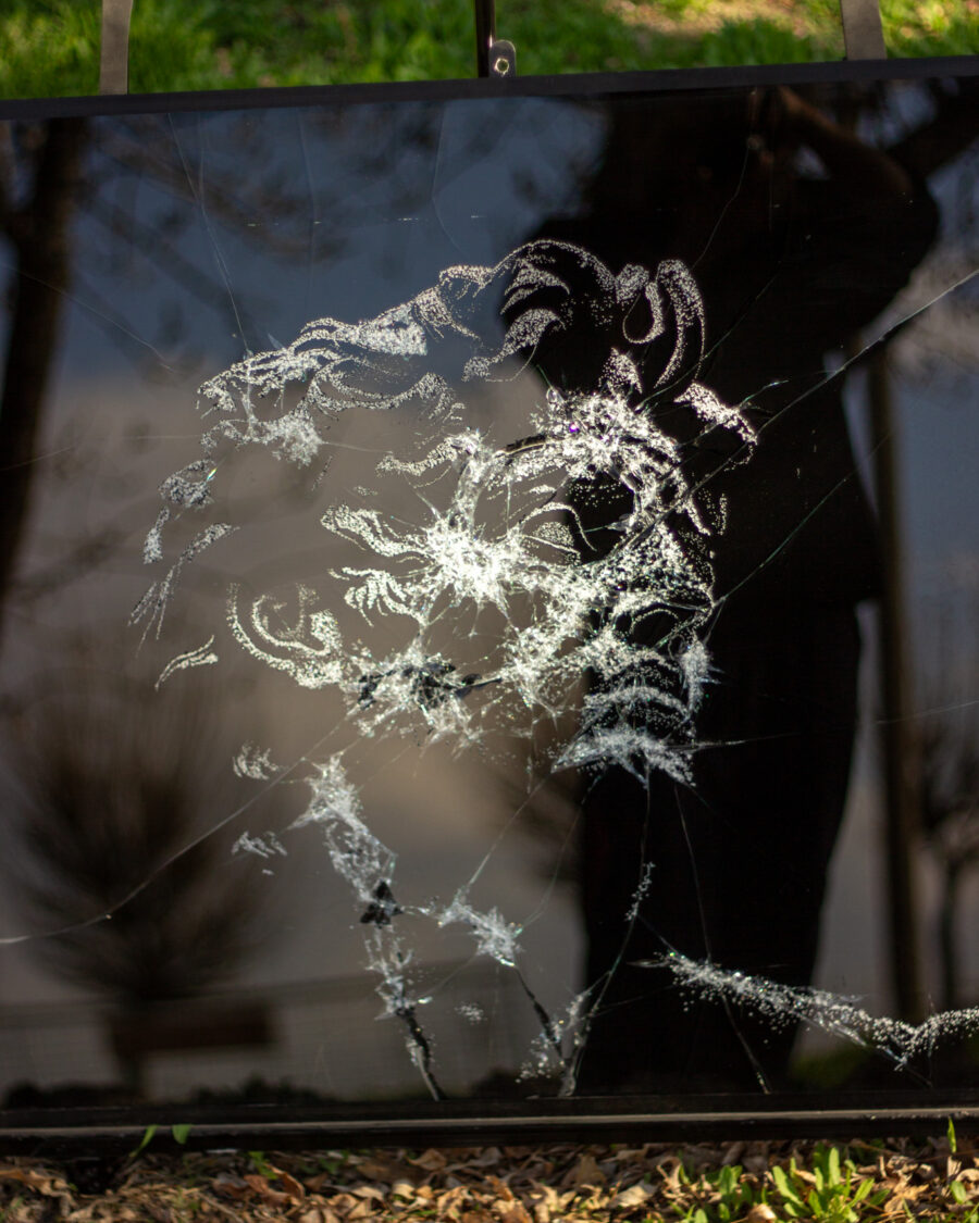 Detail of Dionisos in fractured glass