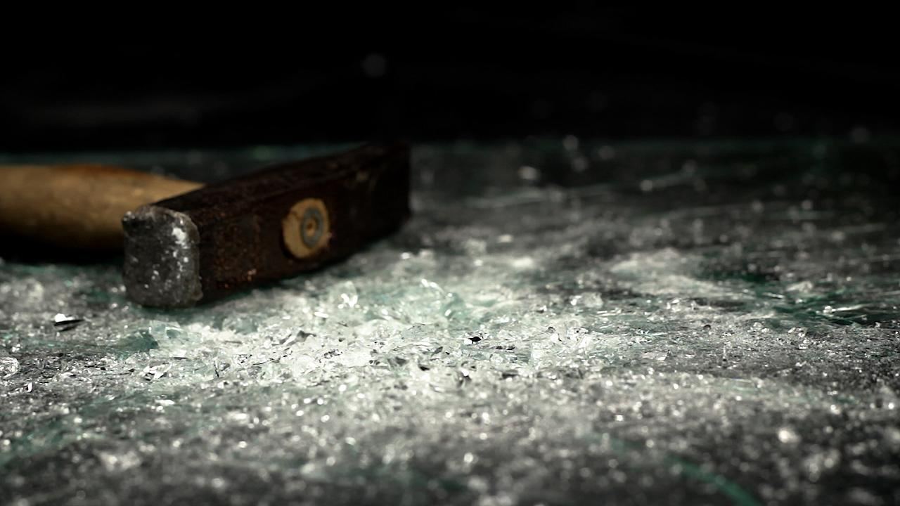 Fractures spreading through laminated glass after a hammer strike