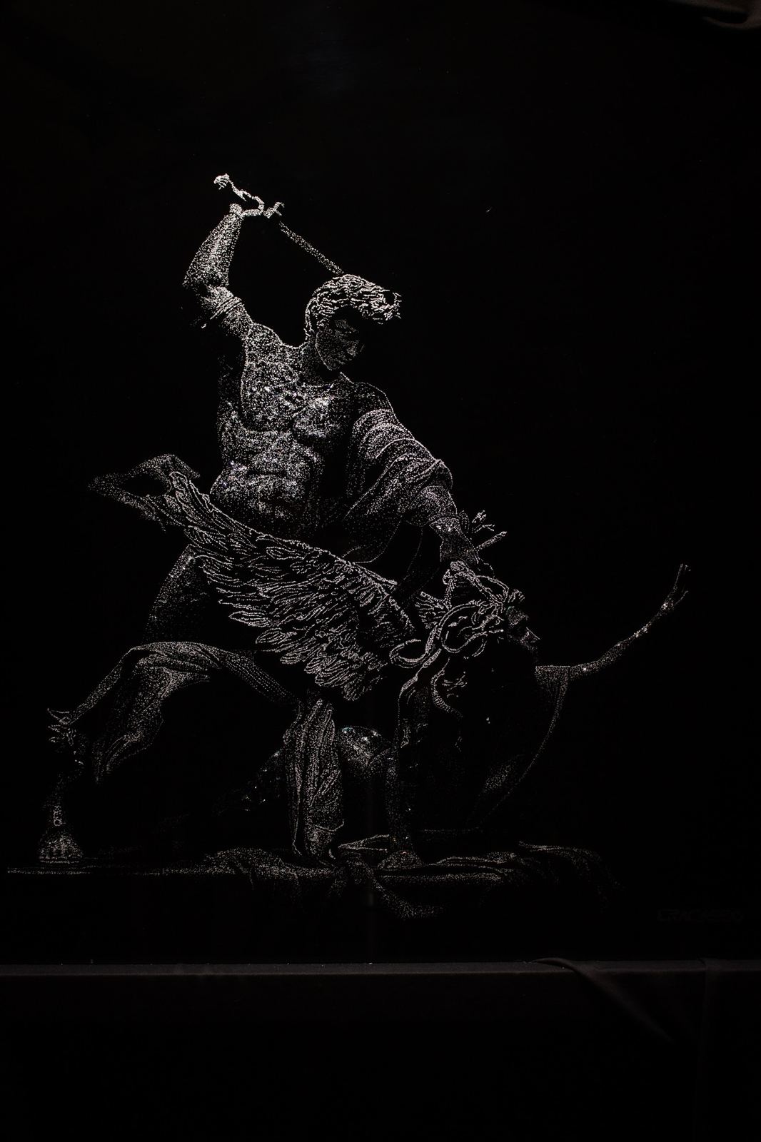 Perseus and Medusa under a single overhead light